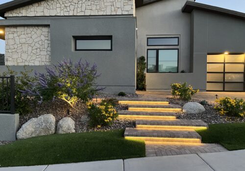 A house with steps leading to the front door.